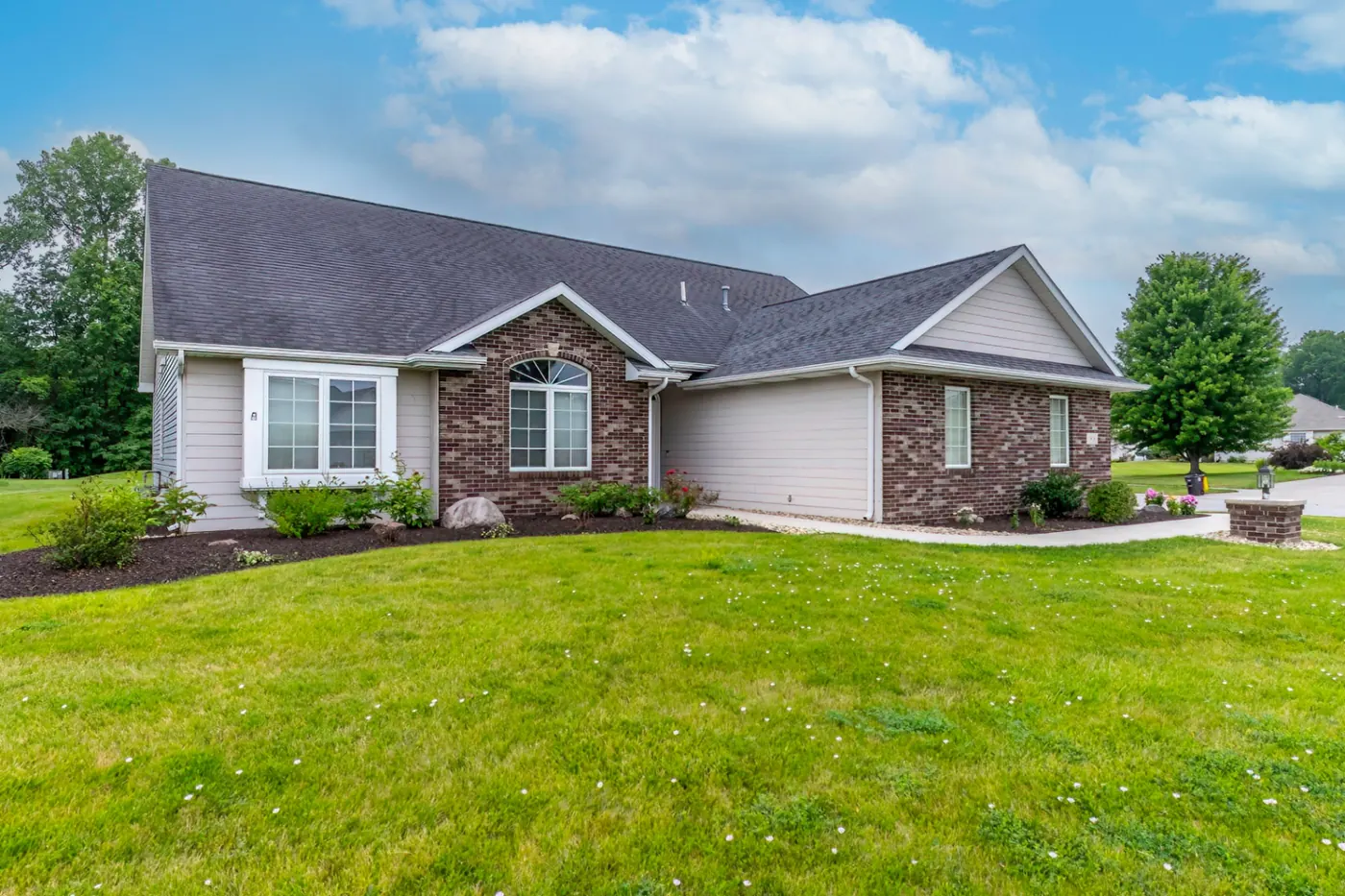 Front angle of the brick facade with arched window at 1906 Kelleys Landing, Fort Wayne IN