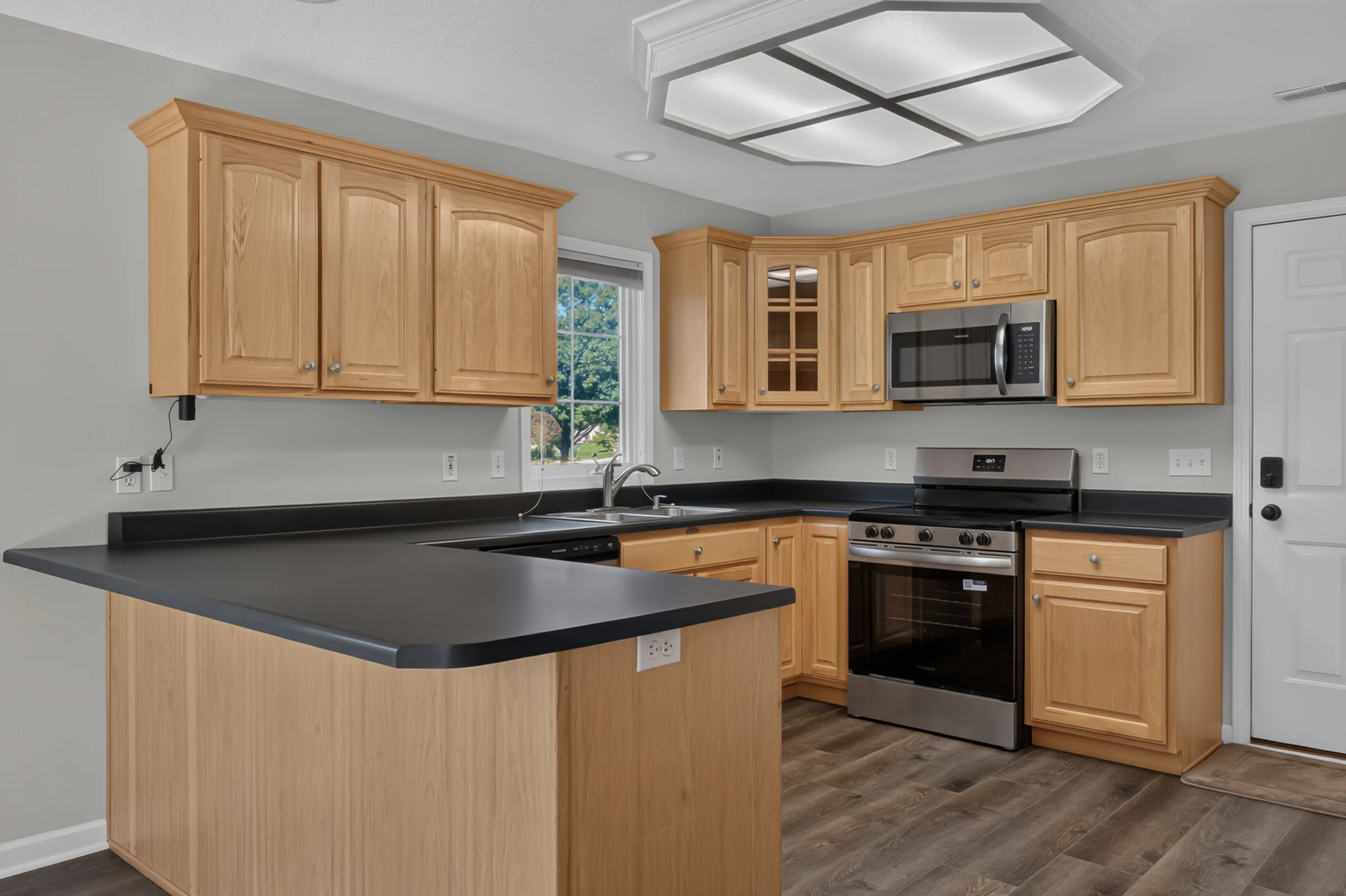 Kitchen with new stainless steel range, microwave and dishwasher at 1906 Kelleys Landing