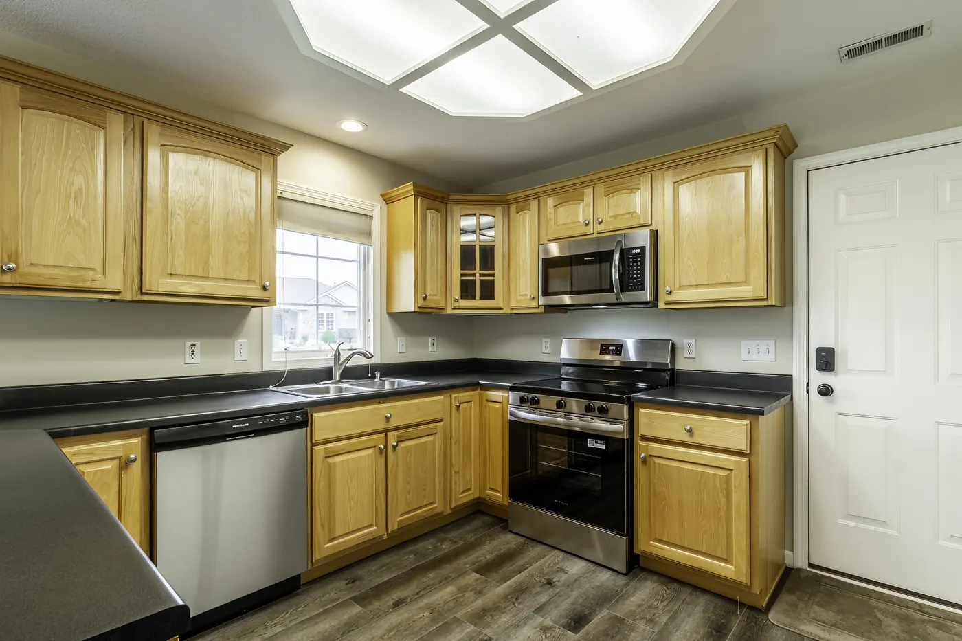 Kitchen at 1906 Kelleys Landing, Fort Wayne IN featuring new stainless steel range and microwave