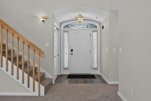 Main Level · Foyer and loft staircase at 1906 Kelleys Landing